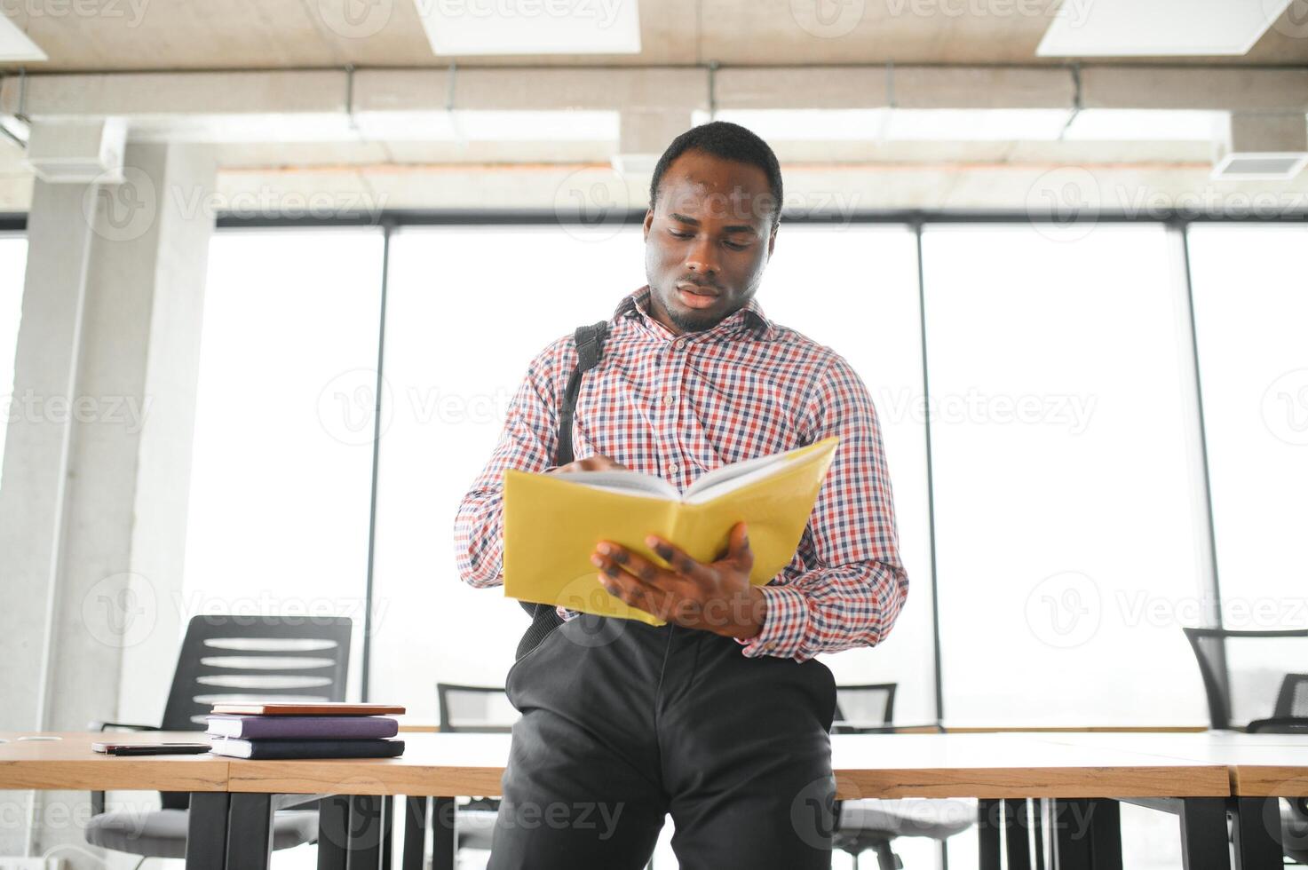 black student at university classroom and thinking of something photo