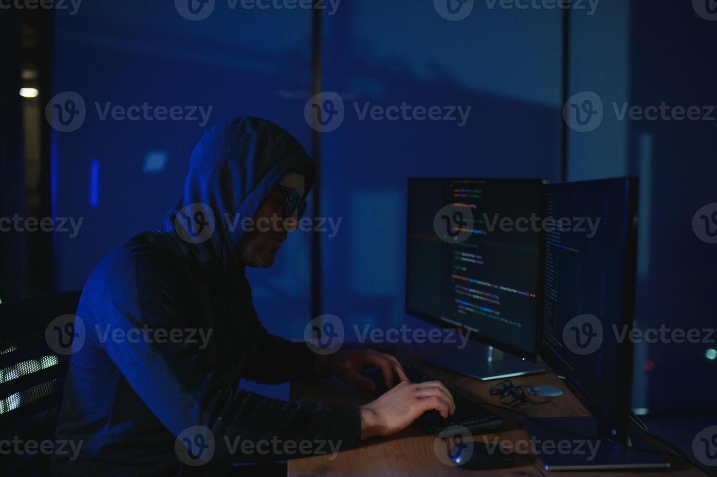 Hacker is hacking into the computer network. Computer criminal photo