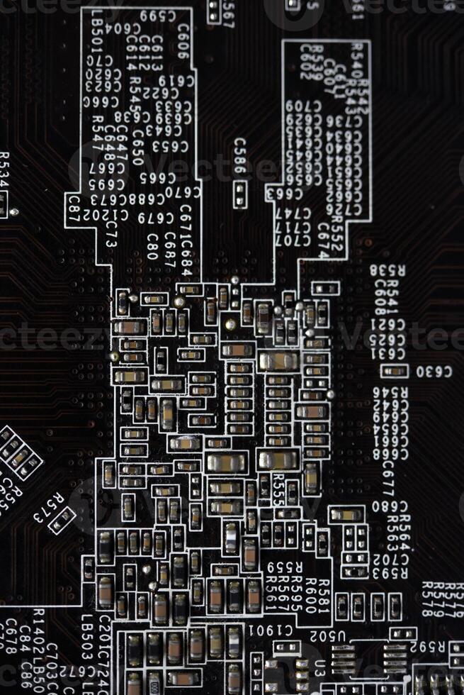 A brown printed circuit board with resistors and capacitors. An electronic board with radio elements. photo