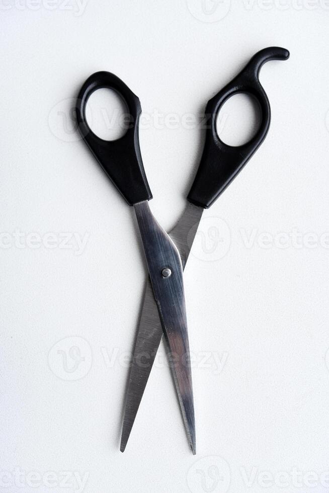 Sewing scissors on a white background. Green scissors. photo