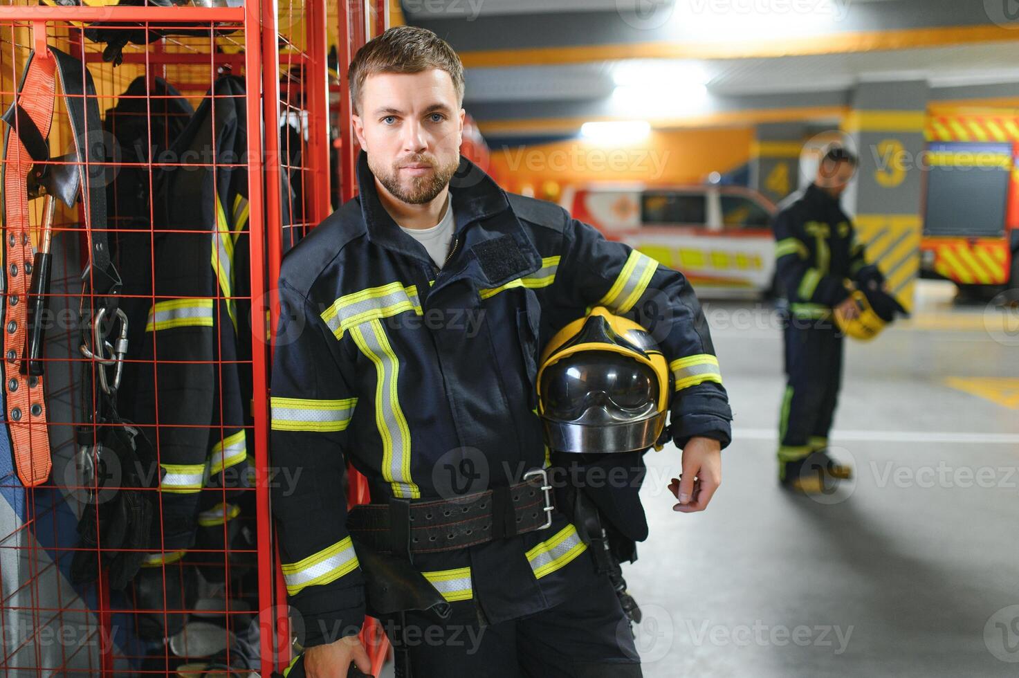 Young handsome fireman in the fire department photo