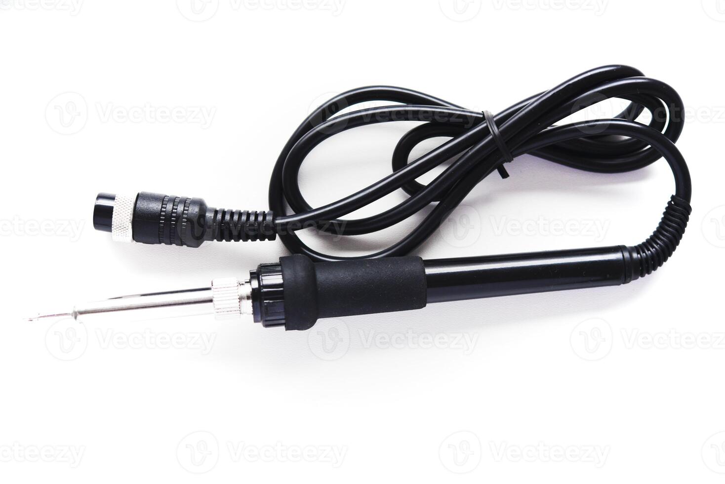 Black plastic soldering iron on a white background. photo