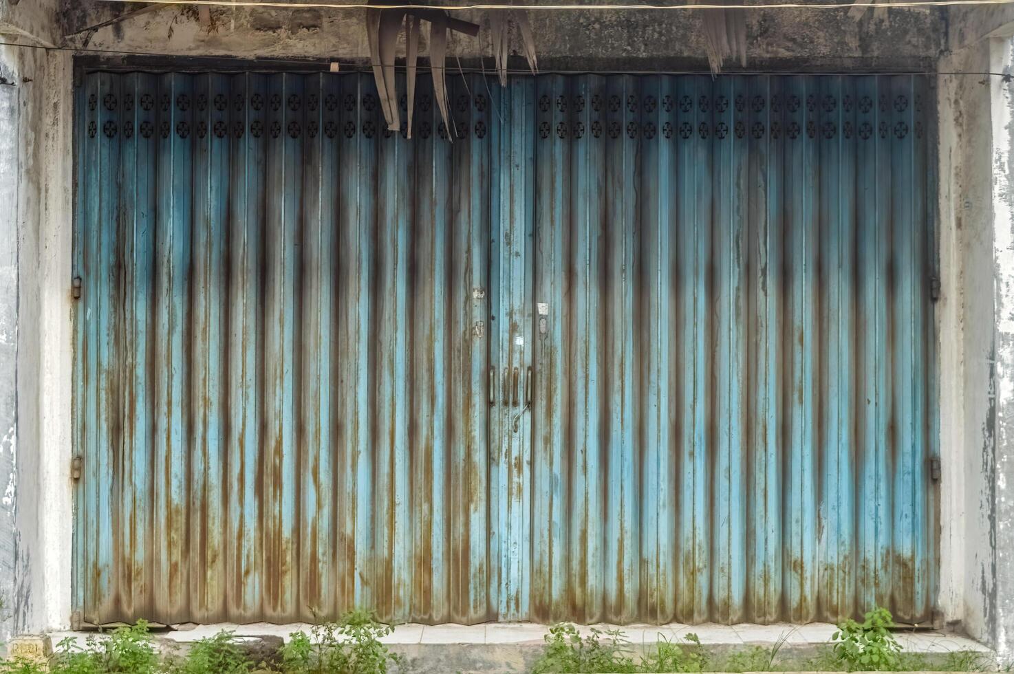 an old rusty iron harmonica door photo