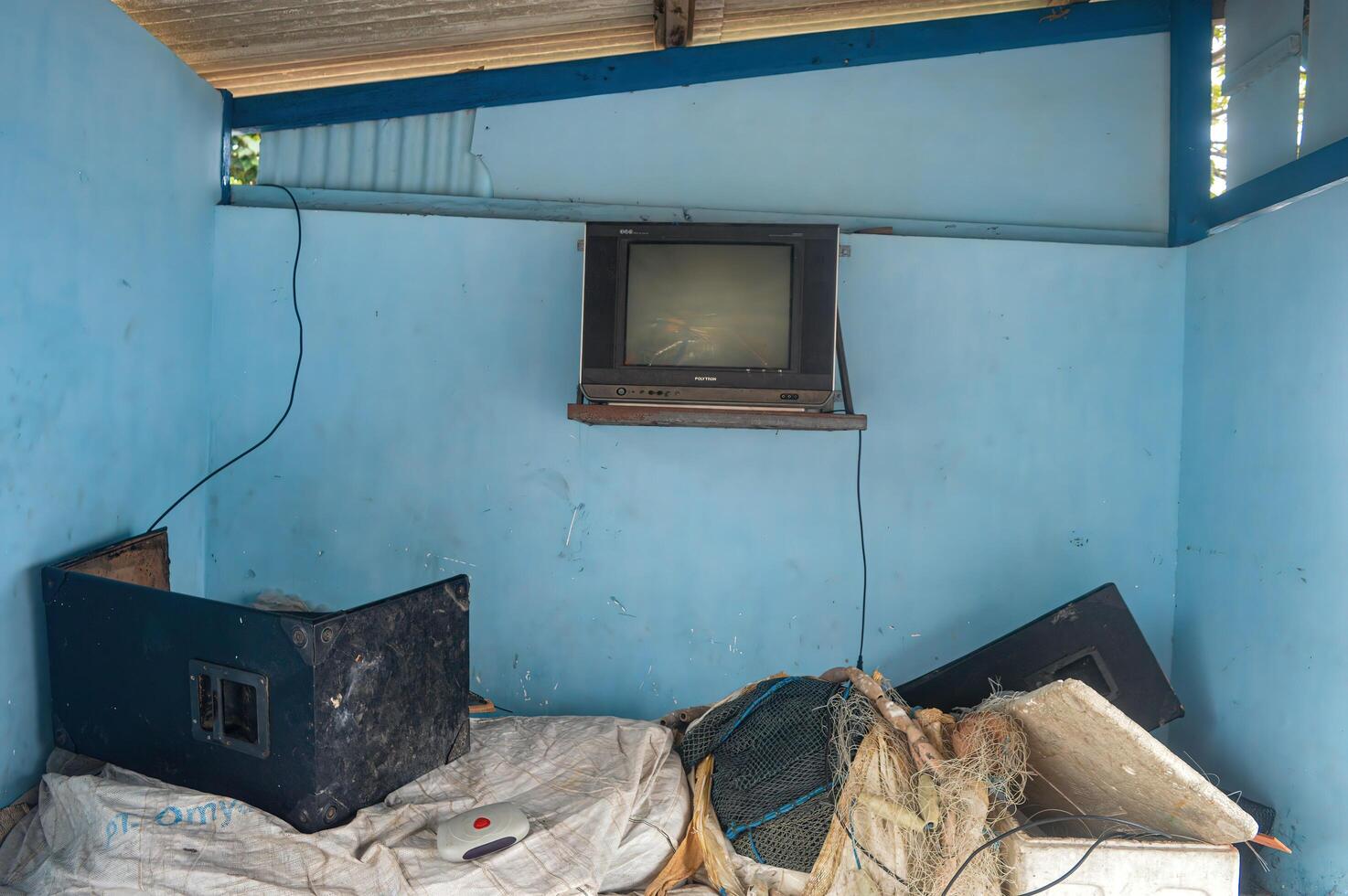 a bunch of junk in a camping post with an old tv that can still be used, Indonesia, 7 April 2023. photo