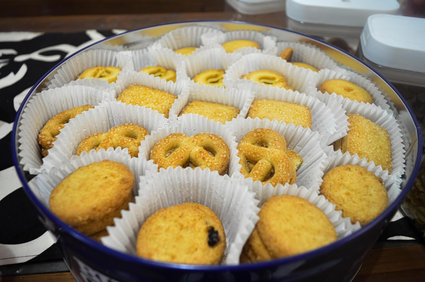 a large tin containing various kinds of biscuits to serve guests for Eid al-Fitr photo