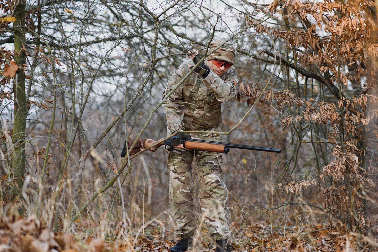 Hunting permit. Man brutal gamekeeper nature background. hunter spend leisure hunting. Hunter hold riffles. Focus and concentration of experienced hunter. Hunting and trapping seasons photo