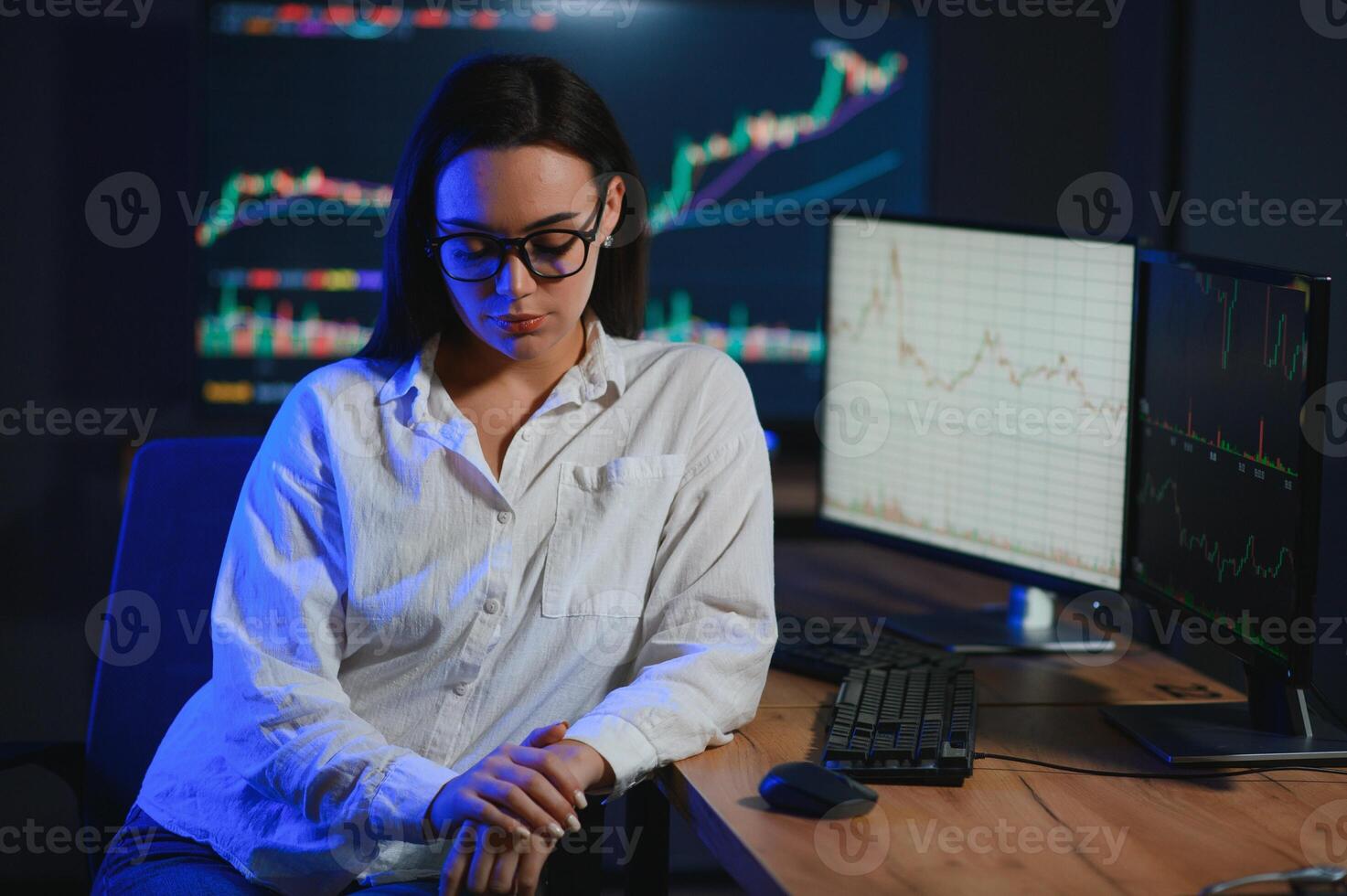 Woman trader. Lady invests through computer. Businesswoman keeps track of stock price photo