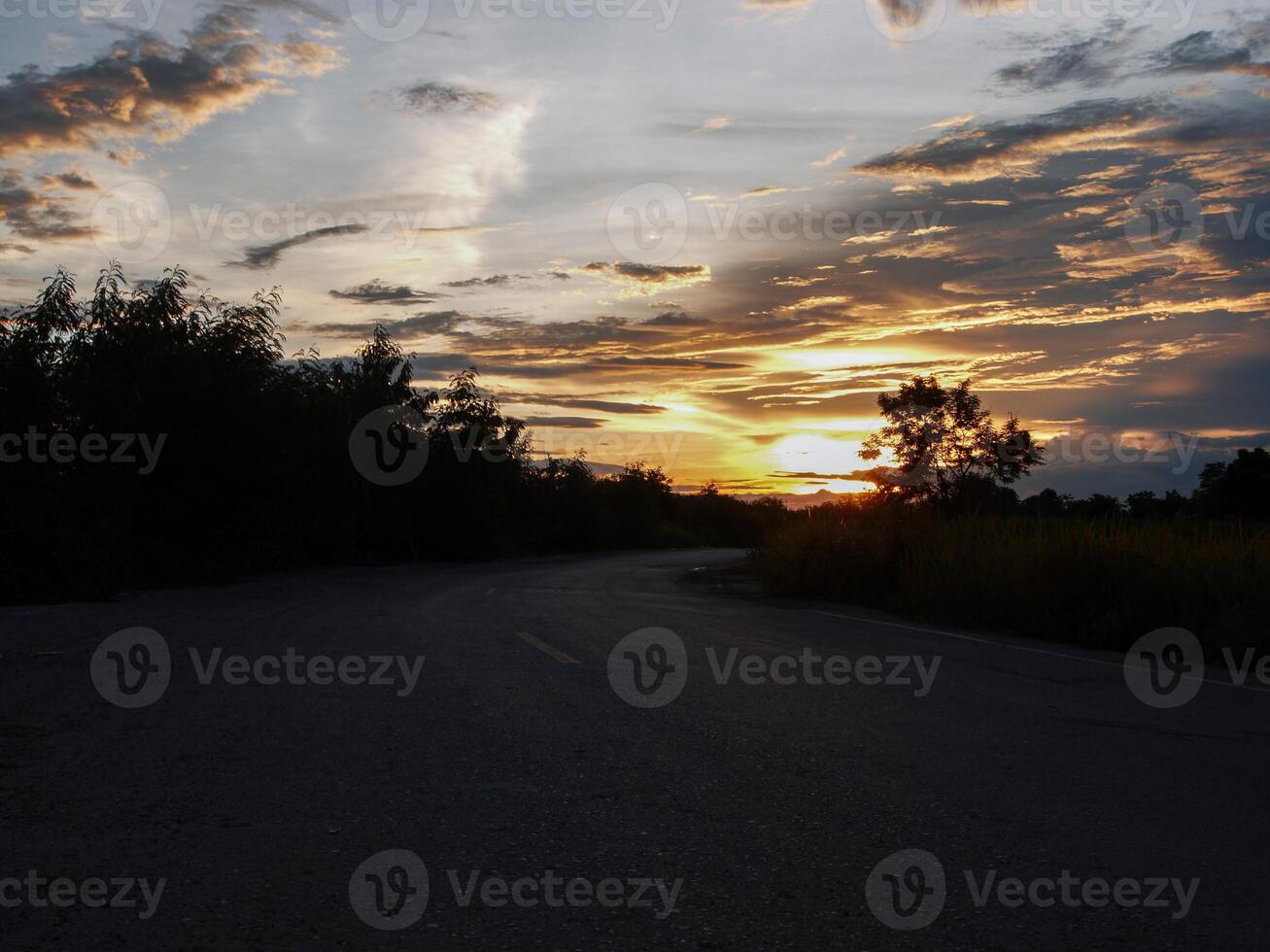 Spectacular sunset over, orange sun rising up over the horizon photo