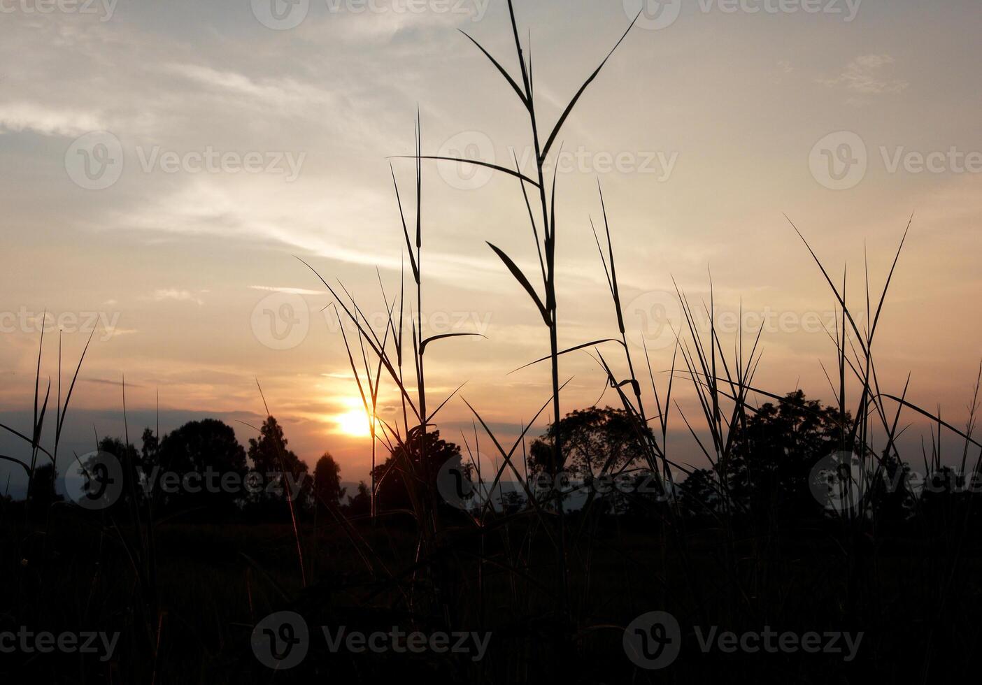 Spectacular sunset over, orange sun rising up over the horizon photo