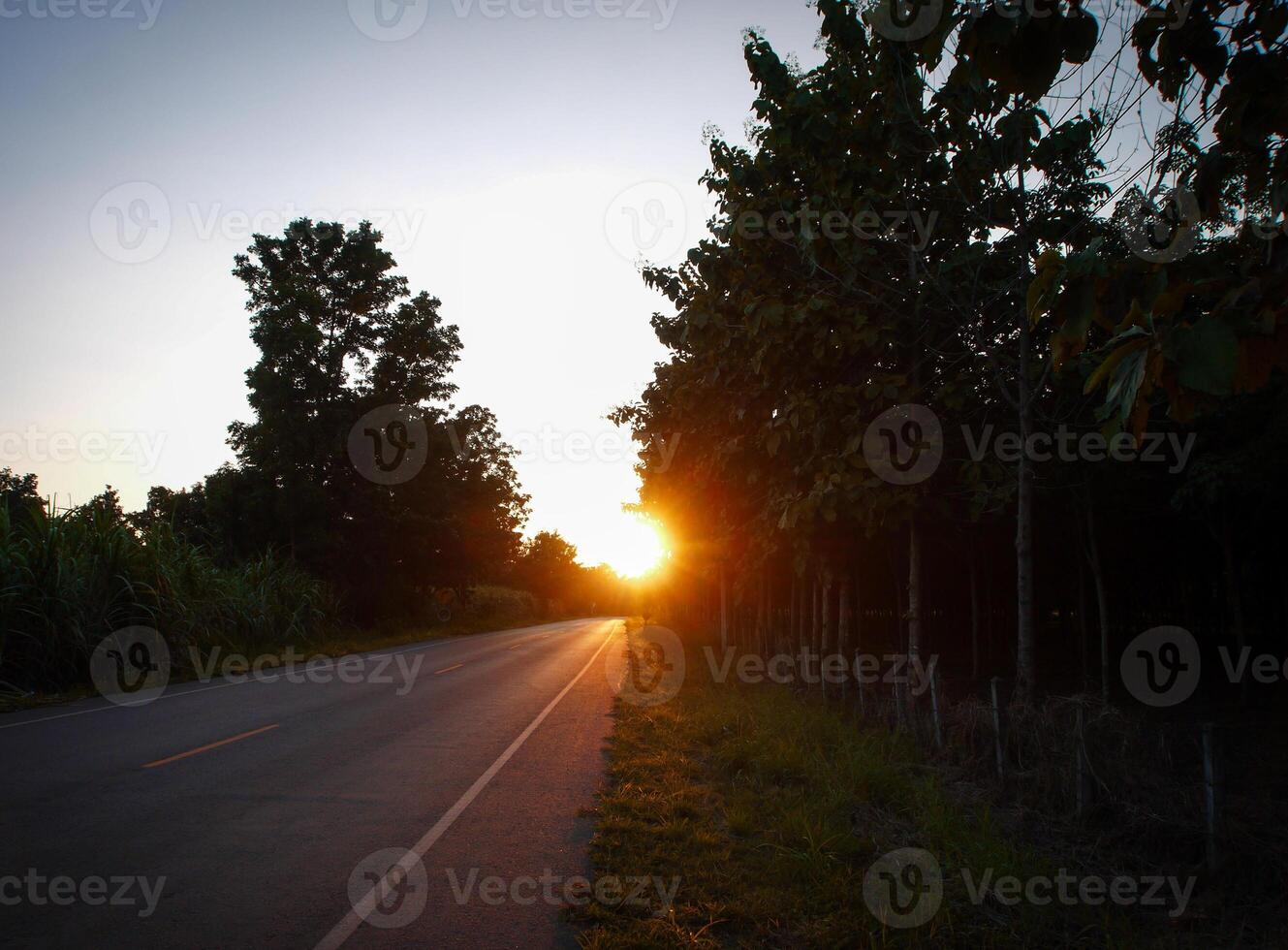 Spectacular sunset over, orange sun rising up over the horizon photo