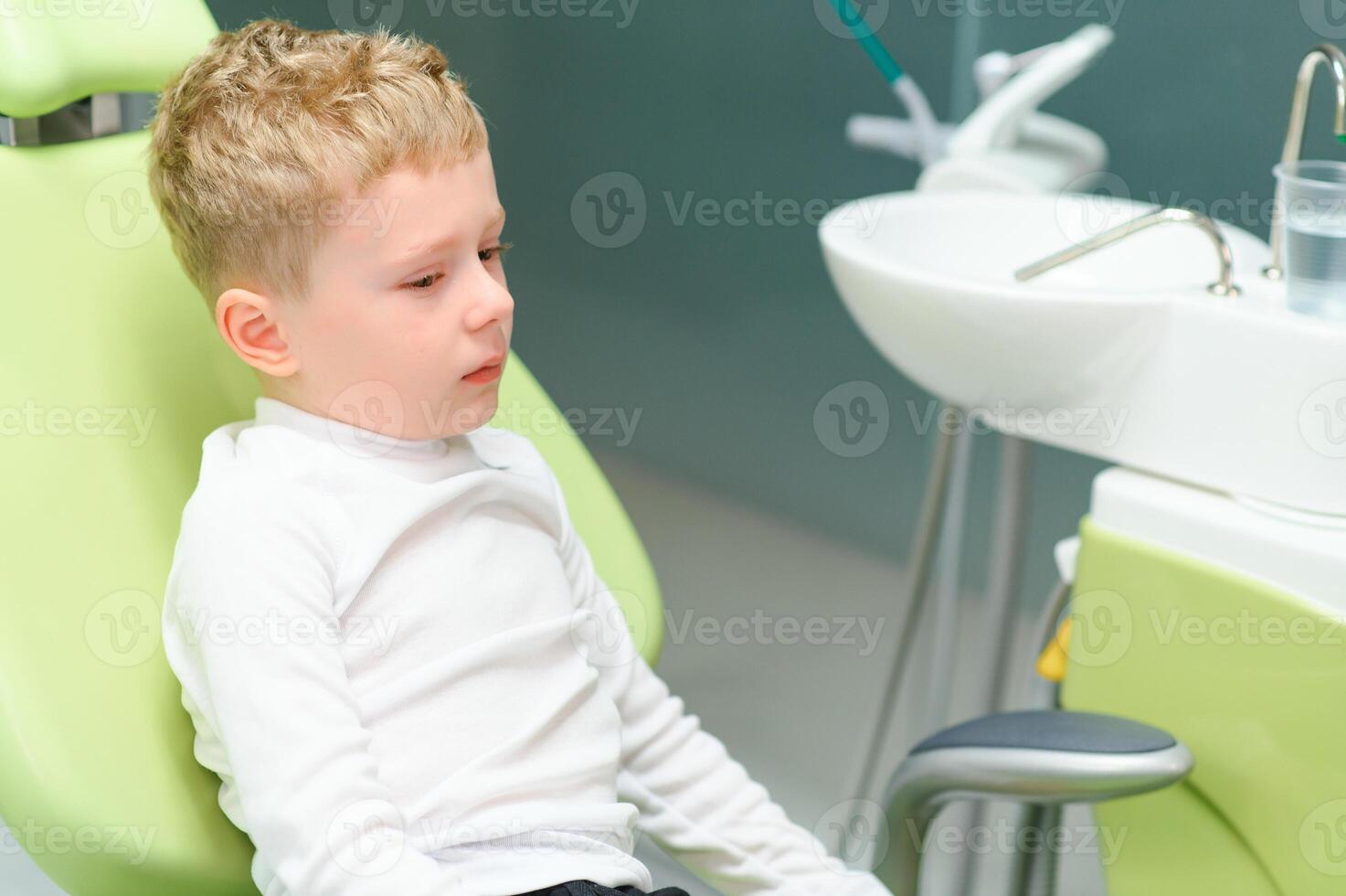Crying and screaming little boy at the dentist photo
