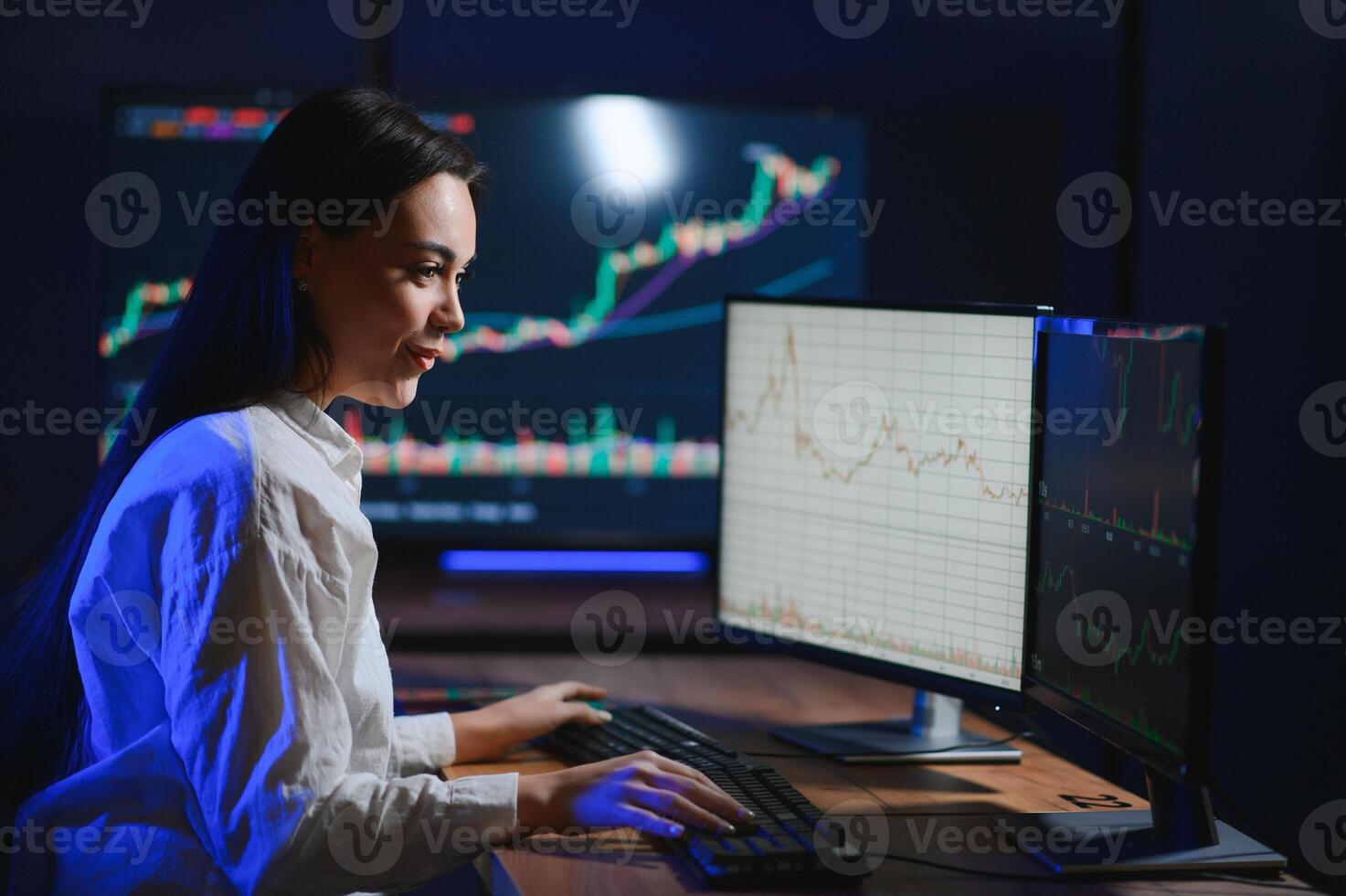 Woman trader. Lady invests through computer. Businesswoman keeps track of stock price photo