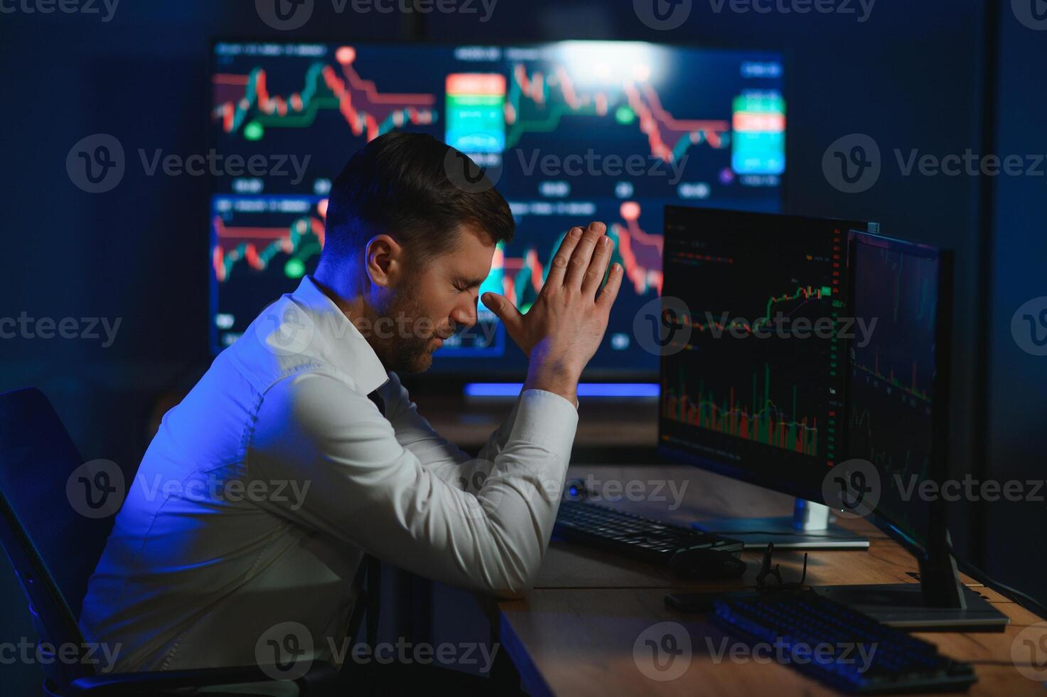 Tired overworked bearded man, crypto trader having headache, lost money photo