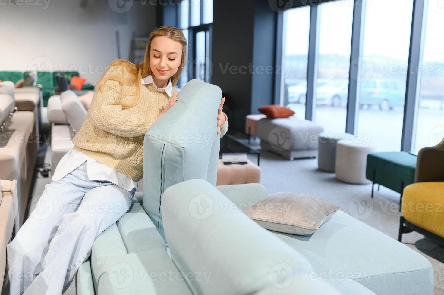 young woman shopping for furniture, sofa and home decor in store photo