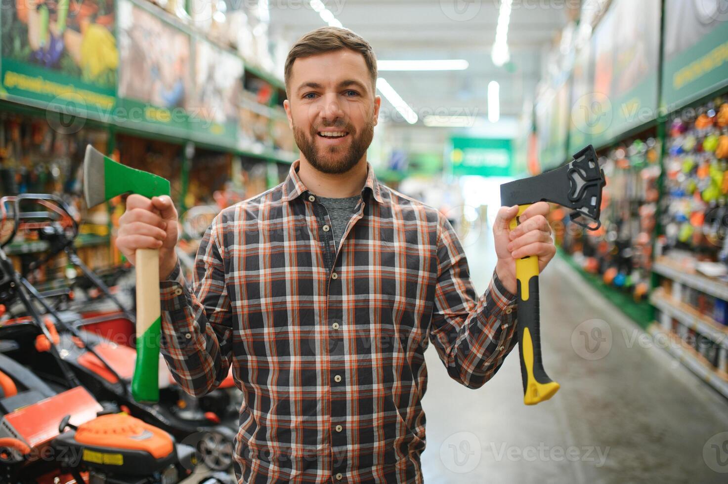 happy customer in a hardware store buying a new ax photo