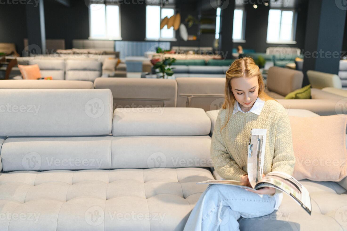 young woman shopping for furniture, sofa and home decor in store photo