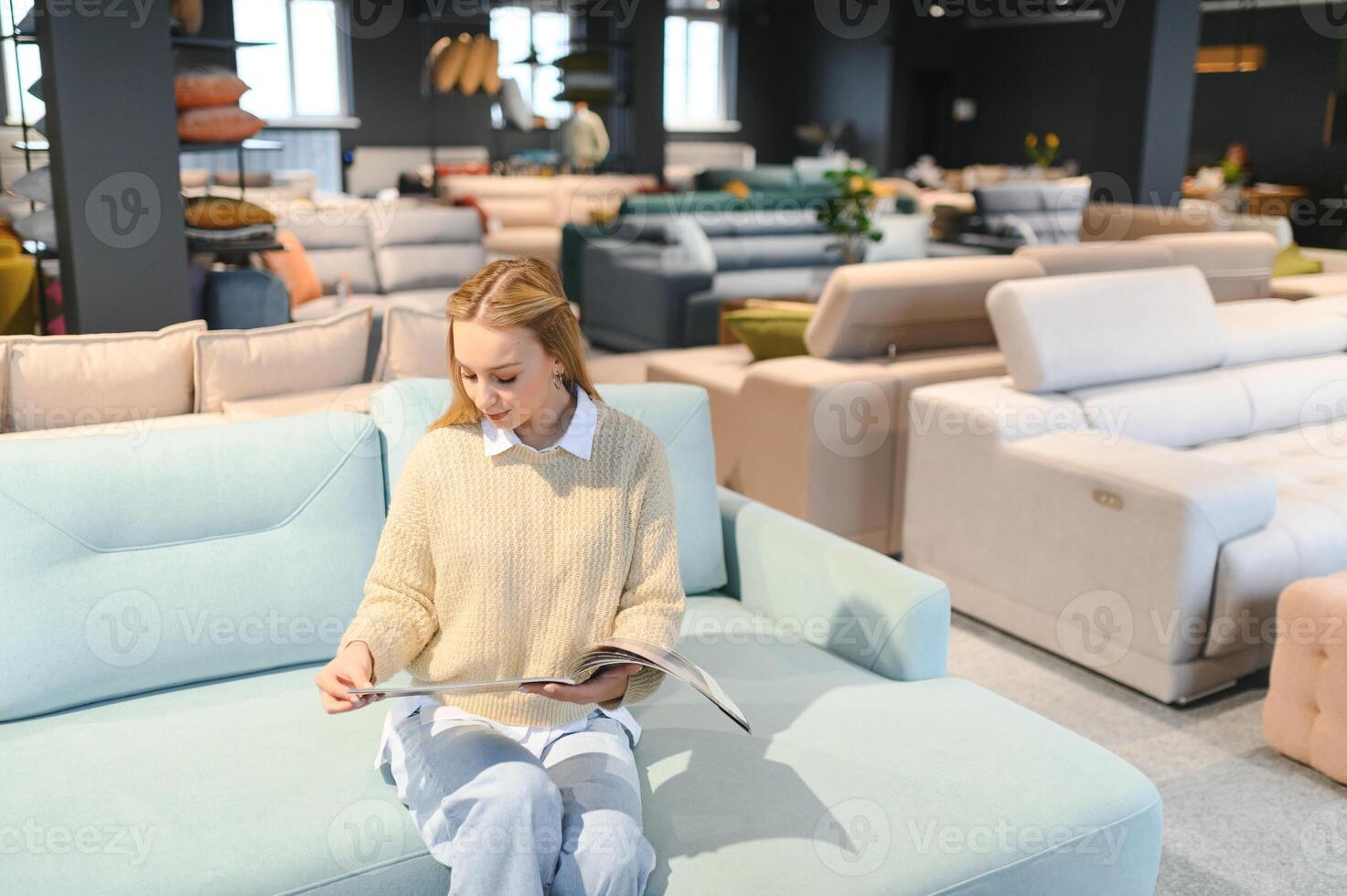 young woman shopping for furniture, sofa and home decor in store photo