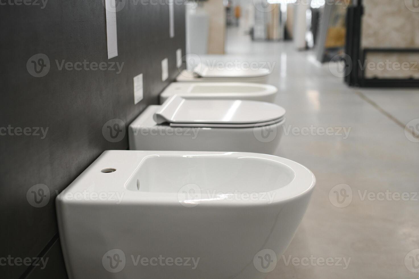 samples of modern sanitary ware for the toilet. new modern toilet in the plumbing store photo