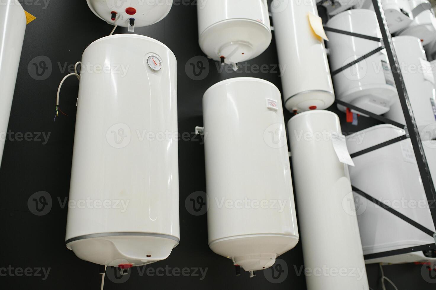 Variety of modern electric boilers presented in store photo