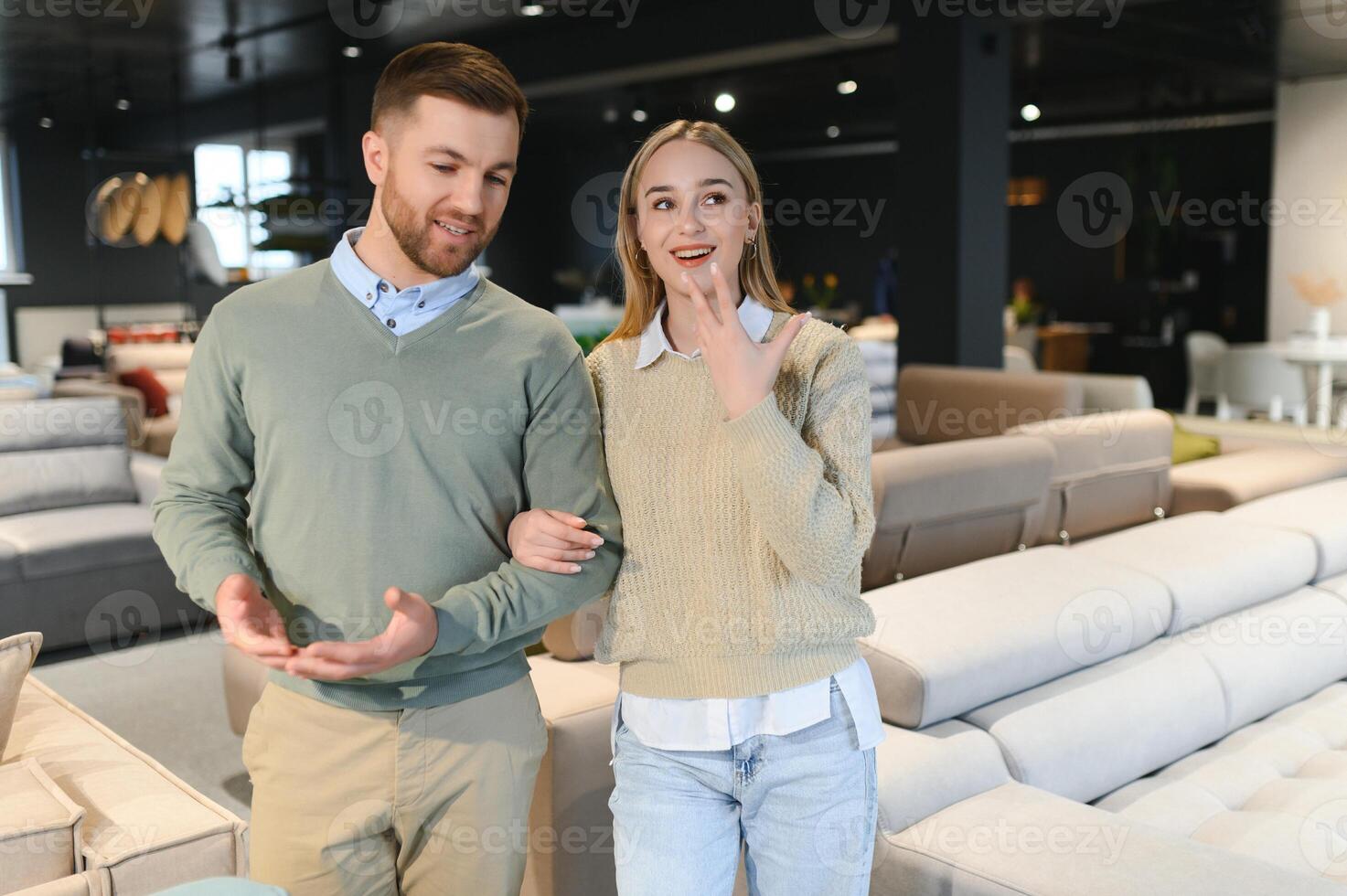 Attractive woman with her husband at the furniture store showroom photo