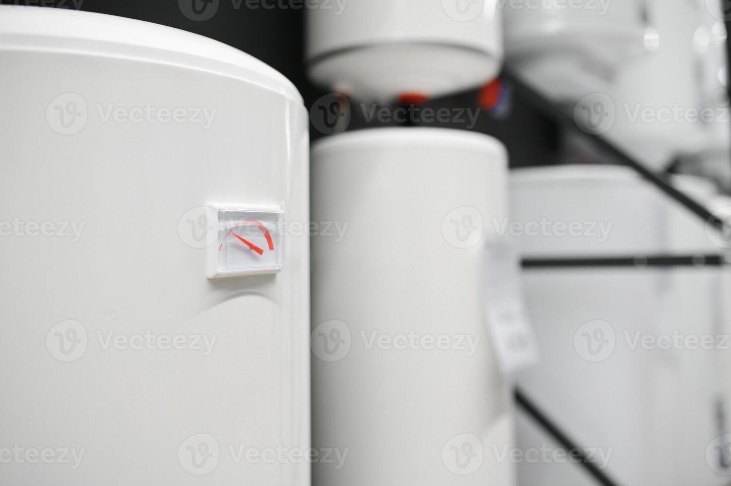 Variety of modern electric boilers presented in store photo