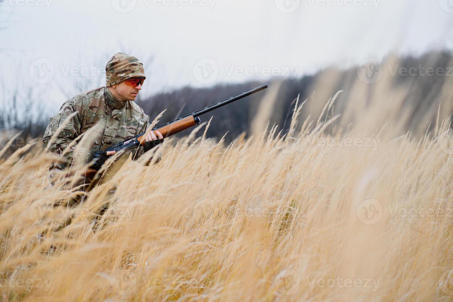 Hunting permit. Man brutal gamekeeper nature background. hunter spend leisure hunting. Hunter hold riffles. Focus and concentration of experienced hunter. Hunting and trapping seasons. photo