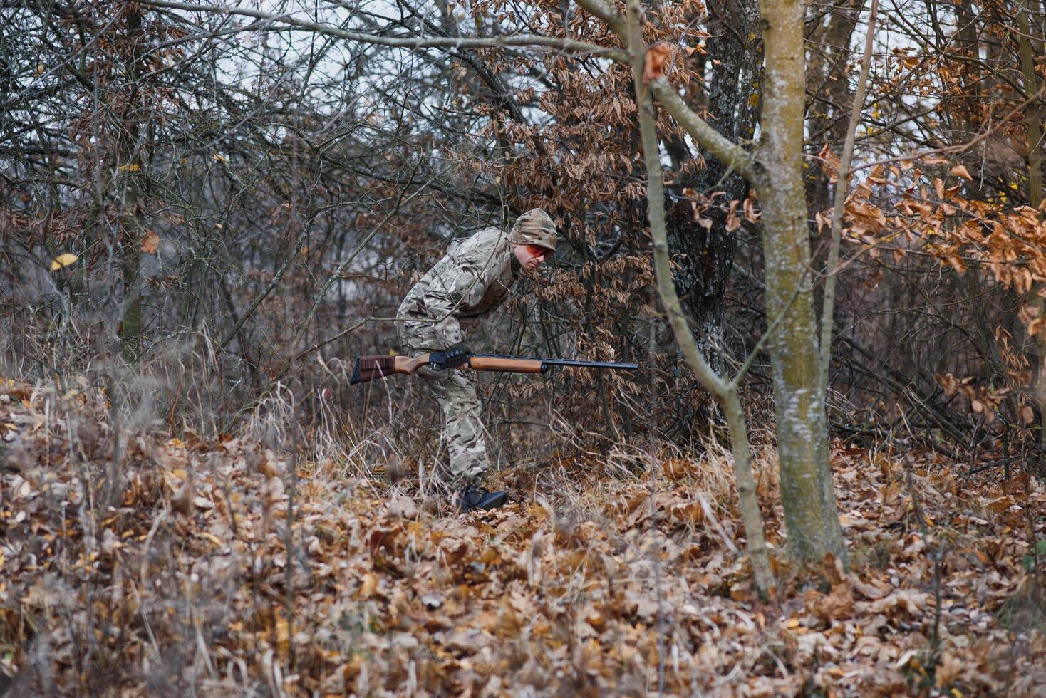 Hunting permit. Man brutal gamekeeper nature background. hunter spend leisure hunting. Hunter hold riffles. Focus and concentration of experienced hunter. Hunting and trapping seasons photo