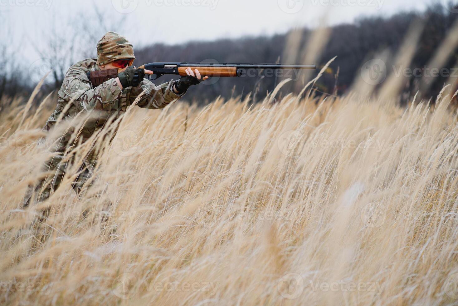 Hunting permit. Man brutal gamekeeper nature background. hunter spend leisure hunting. Hunter hold riffles. Focus and concentration of experienced hunter. Hunting and trapping seasons photo