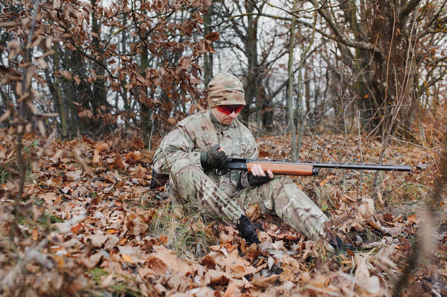 Hunting permit. Man brutal gamekeeper nature background. hunter spend leisure hunting. Hunter hold riffles. Focus and concentration of experienced hunter. Hunting and trapping seasons photo