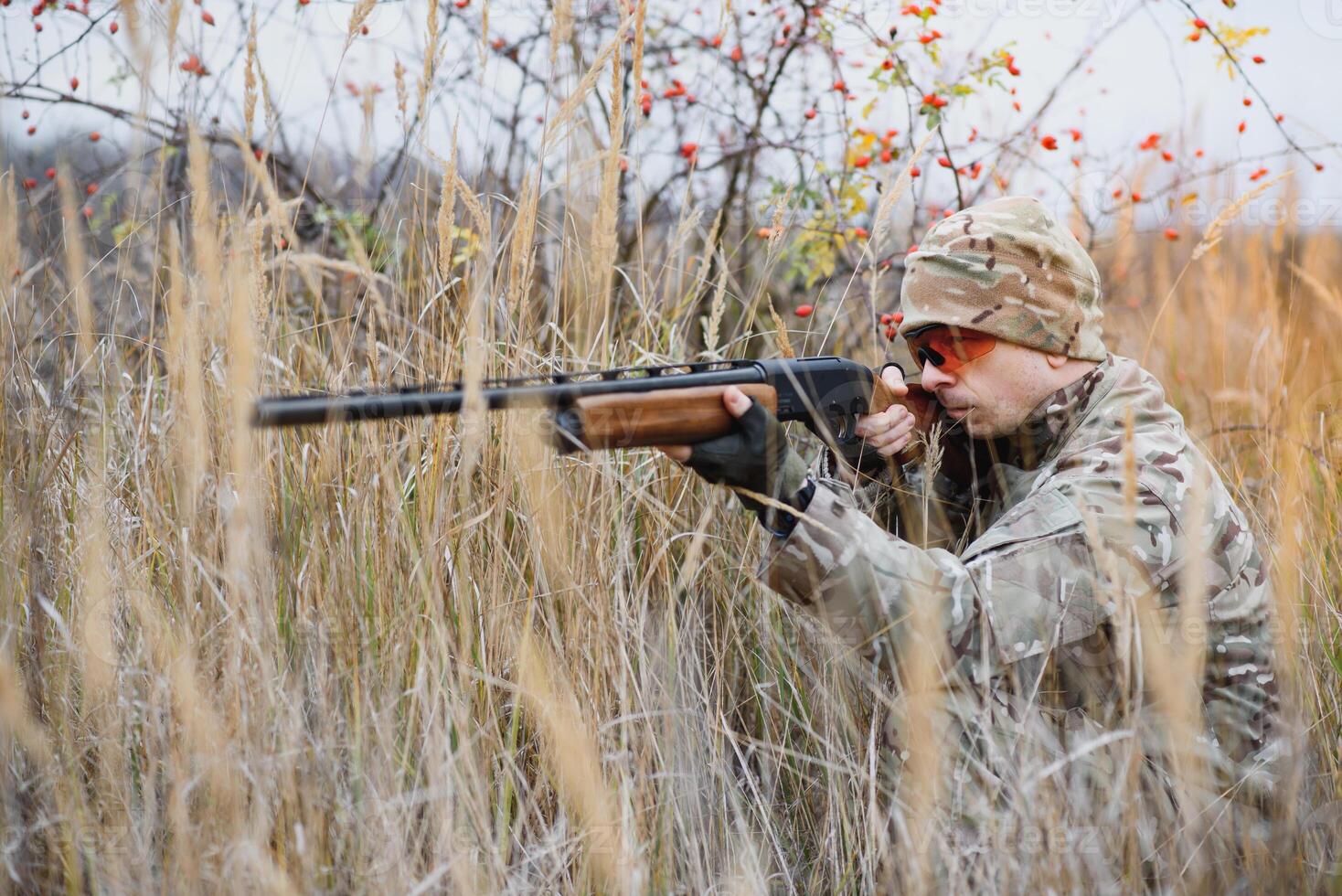 Hunting permit. Man brutal gamekeeper nature background. hunter spend leisure hunting. Hunter hold riffles. Focus and concentration of experienced hunter. Hunting and trapping seasons. photo