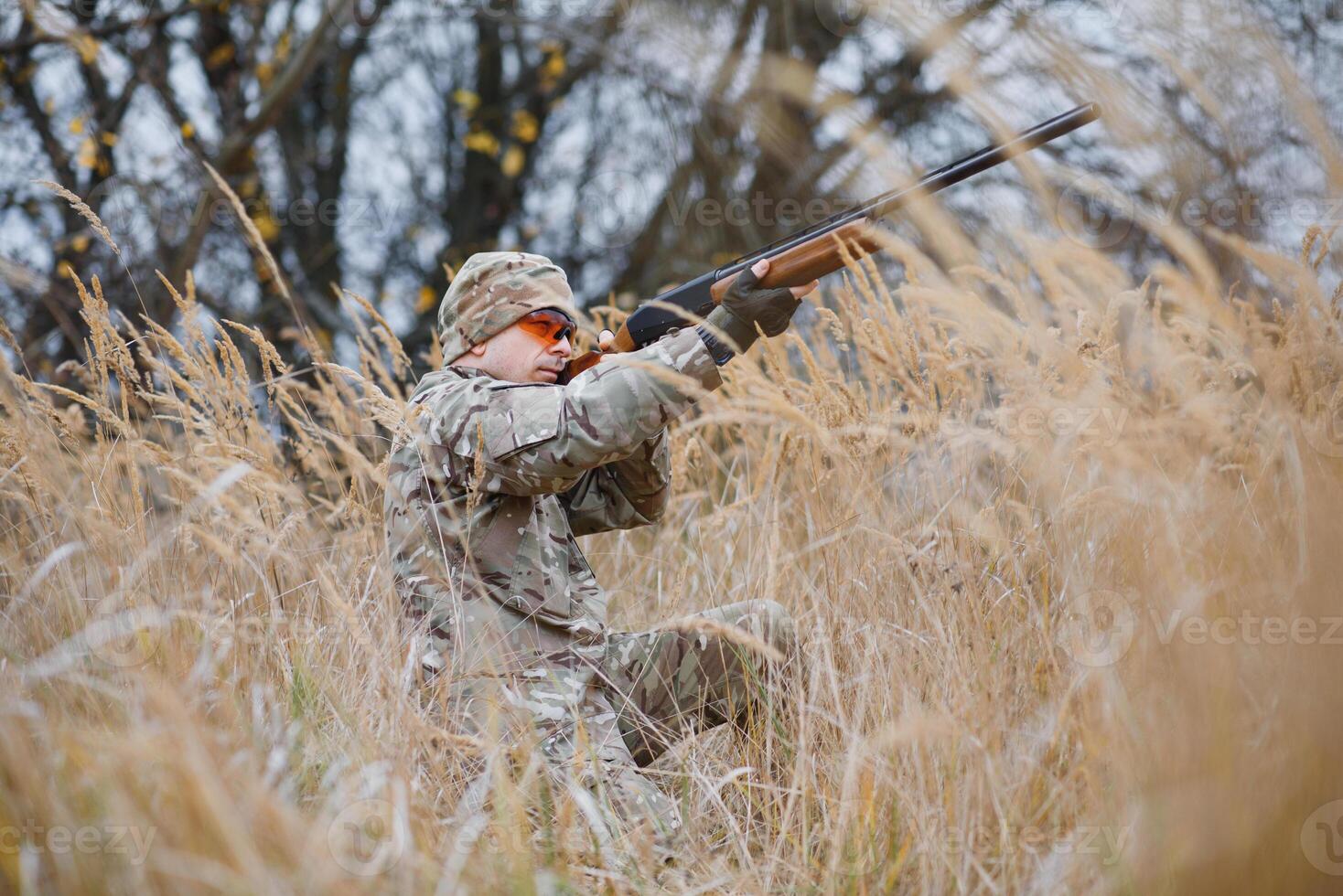 Hunting permit. Man brutal gamekeeper nature background. hunter spend leisure hunting. Hunter hold riffles. Focus and concentration of experienced hunter. Hunting and trapping seasons photo