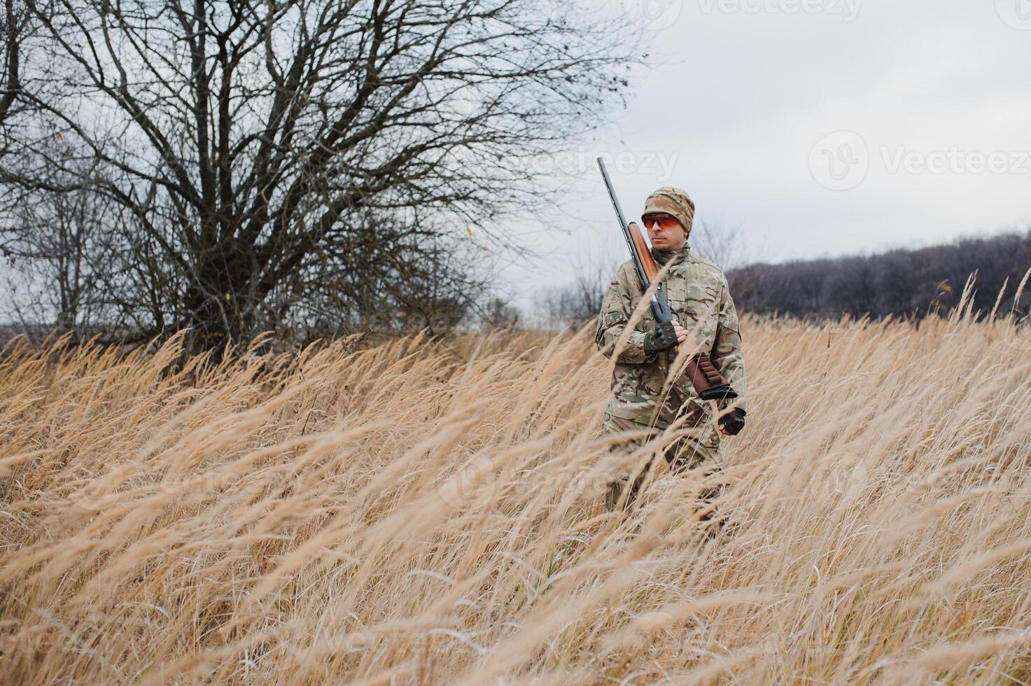 Hunting permit. Man brutal gamekeeper nature background. hunter spend leisure hunting. Hunter hold riffles. Focus and concentration of experienced hunter. Hunting and trapping seasons photo