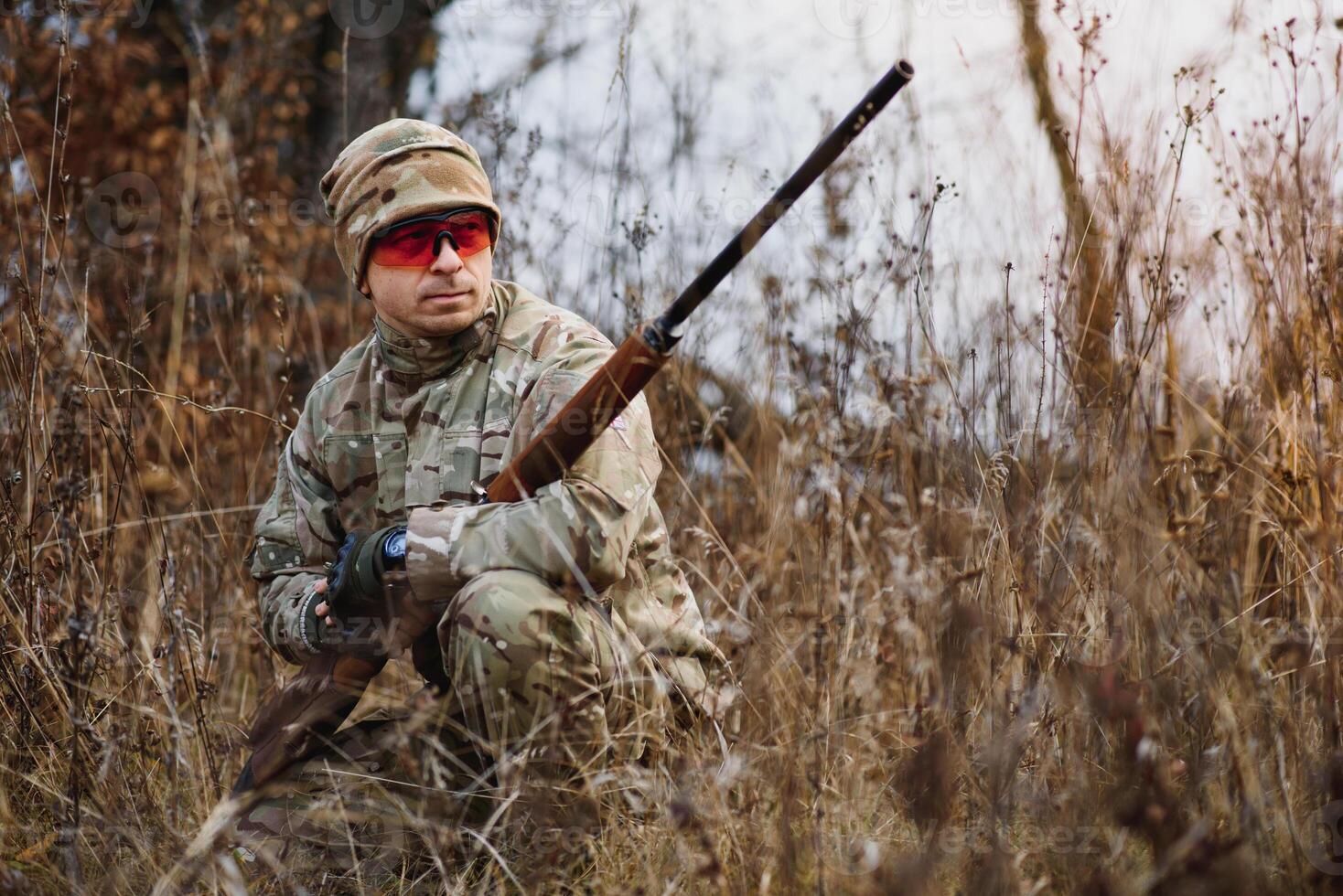 Hunting permit. Man brutal gamekeeper nature background. hunter spend leisure hunting. Hunter hold riffles. Focus and concentration of experienced hunter. Hunting and trapping seasons photo