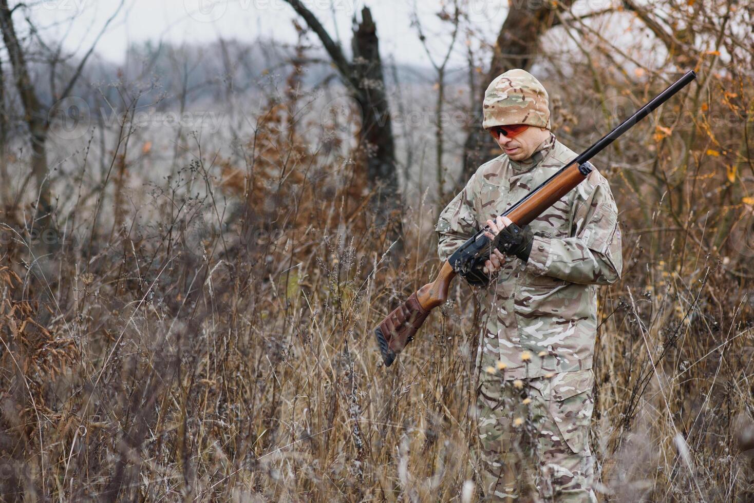 Hunting permit. Man brutal gamekeeper nature background. hunter spend leisure hunting. Hunter hold riffles. Focus and concentration of experienced hunter. Hunting and trapping seasons. photo