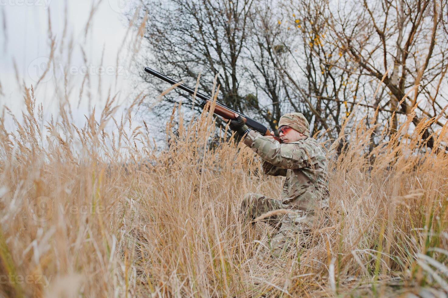 Hunting permit. Man brutal gamekeeper nature background. hunter spend leisure hunting. Hunter hold riffles. Focus and concentration of experienced hunter. Hunting and trapping seasons photo