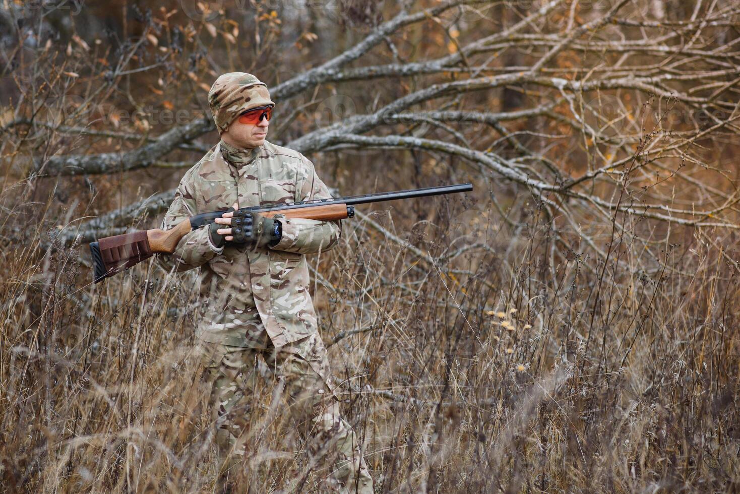 Hunting permit. Man brutal gamekeeper nature background. hunter spend leisure hunting. Hunter hold riffles. Focus and concentration of experienced hunter. Hunting and trapping seasons photo