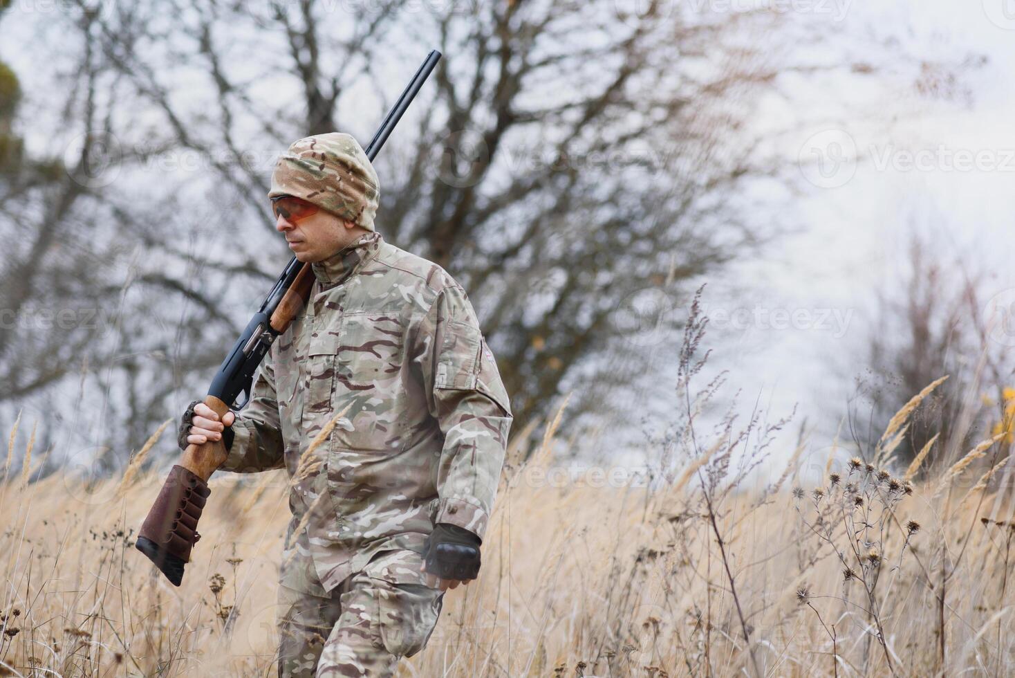 Hunting permit. Man brutal gamekeeper nature background. hunter spend leisure hunting. Hunter hold riffles. Focus and concentration of experienced hunter. Hunting and trapping seasons photo