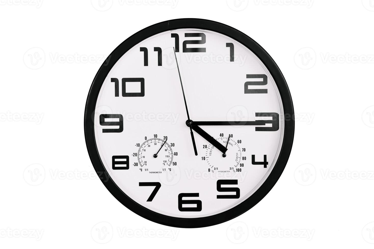 simple classic black and white round wall clock isolated on white. Clock with arabic numerals on wall shows photo