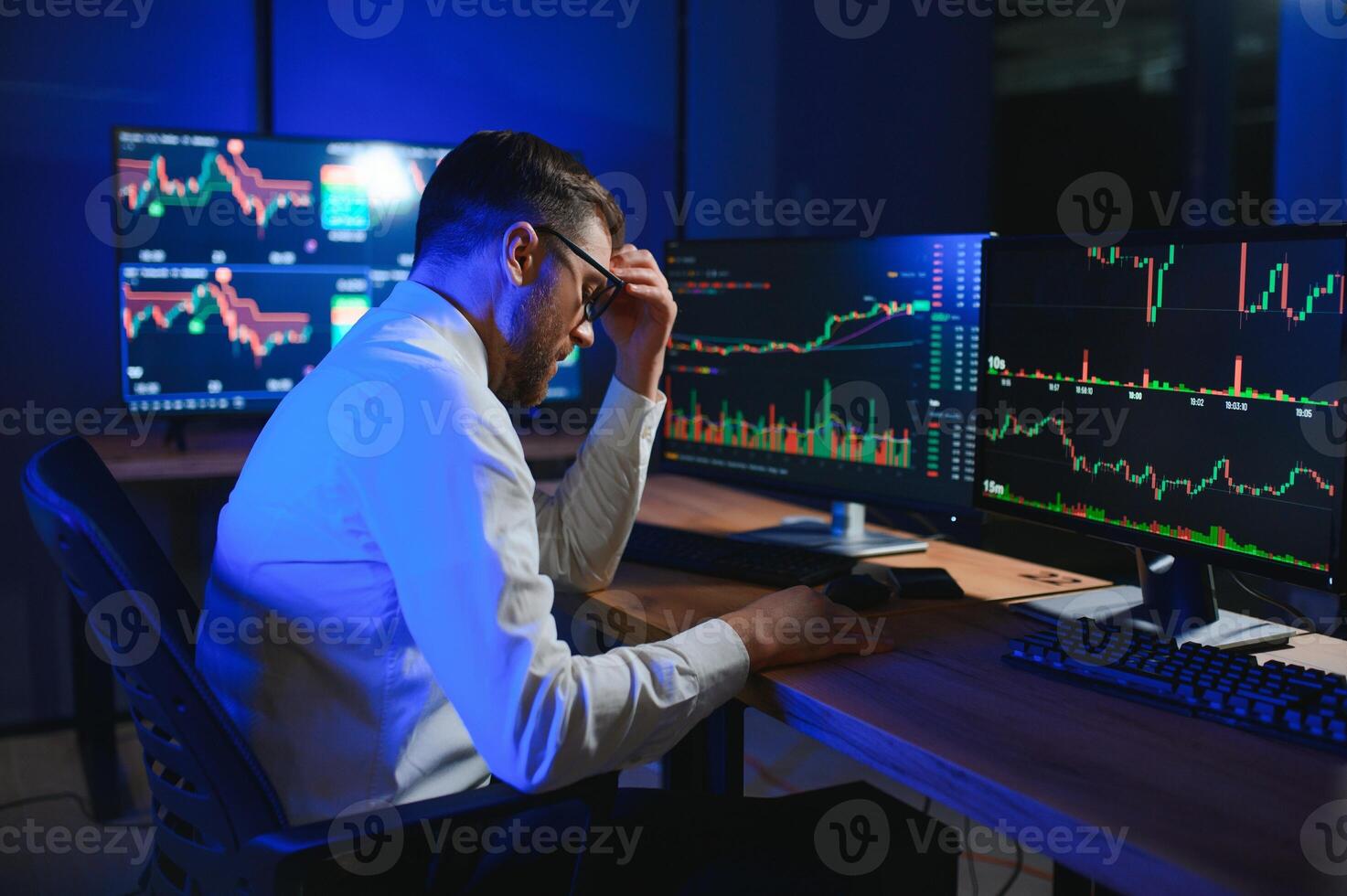 Financial Analysts and Day Traders Working on a Computers with Multi-Monitor photo