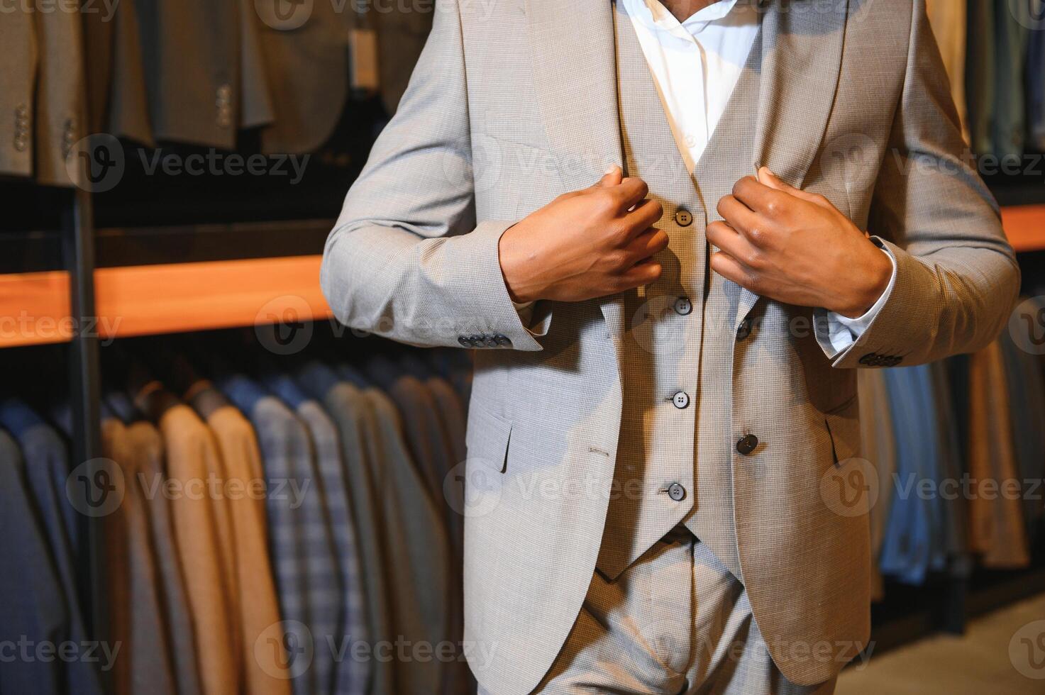 Young african man shopping in clothing store photo