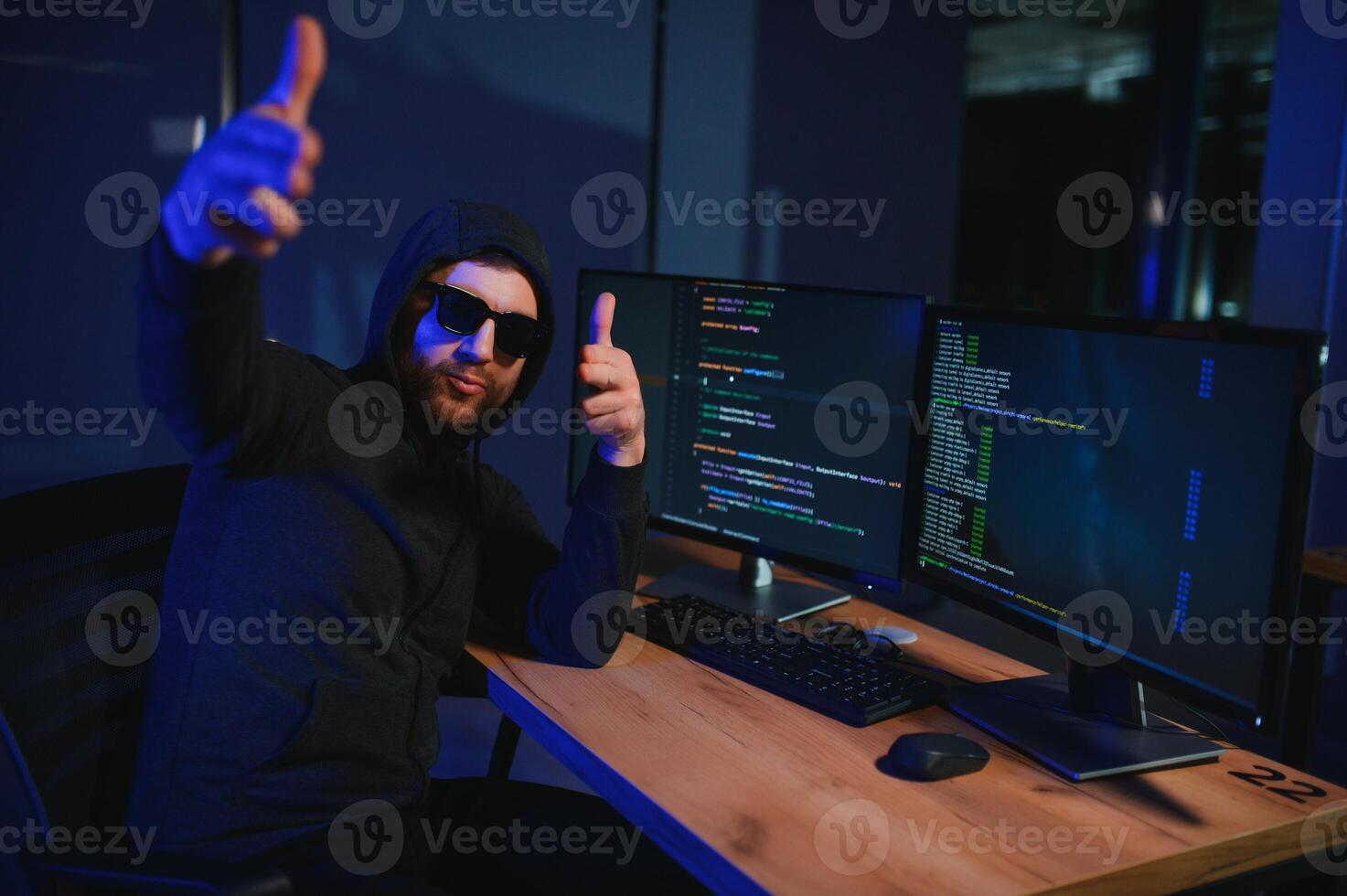 Hacker is hacking into the computer network. Computer criminal photo