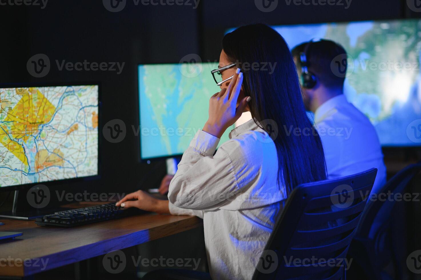 Diverse call center operators team use computers consulting clients in office photo