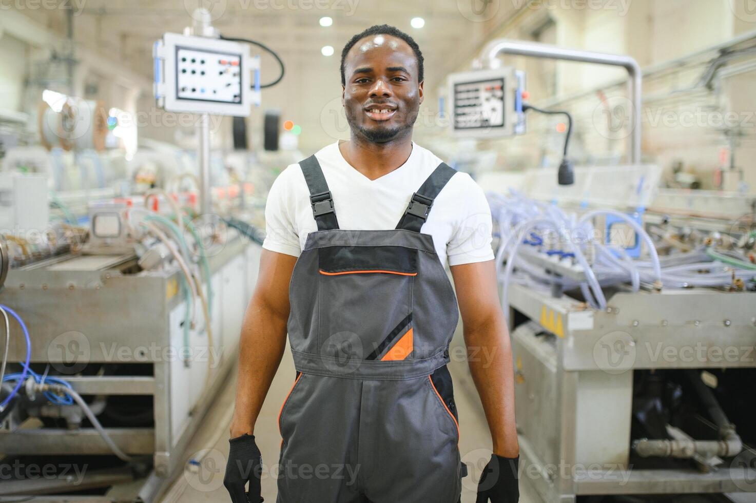 Factory for aluminum and PVC windows and doors production. Manual worker assembling PVC windows and doors photo