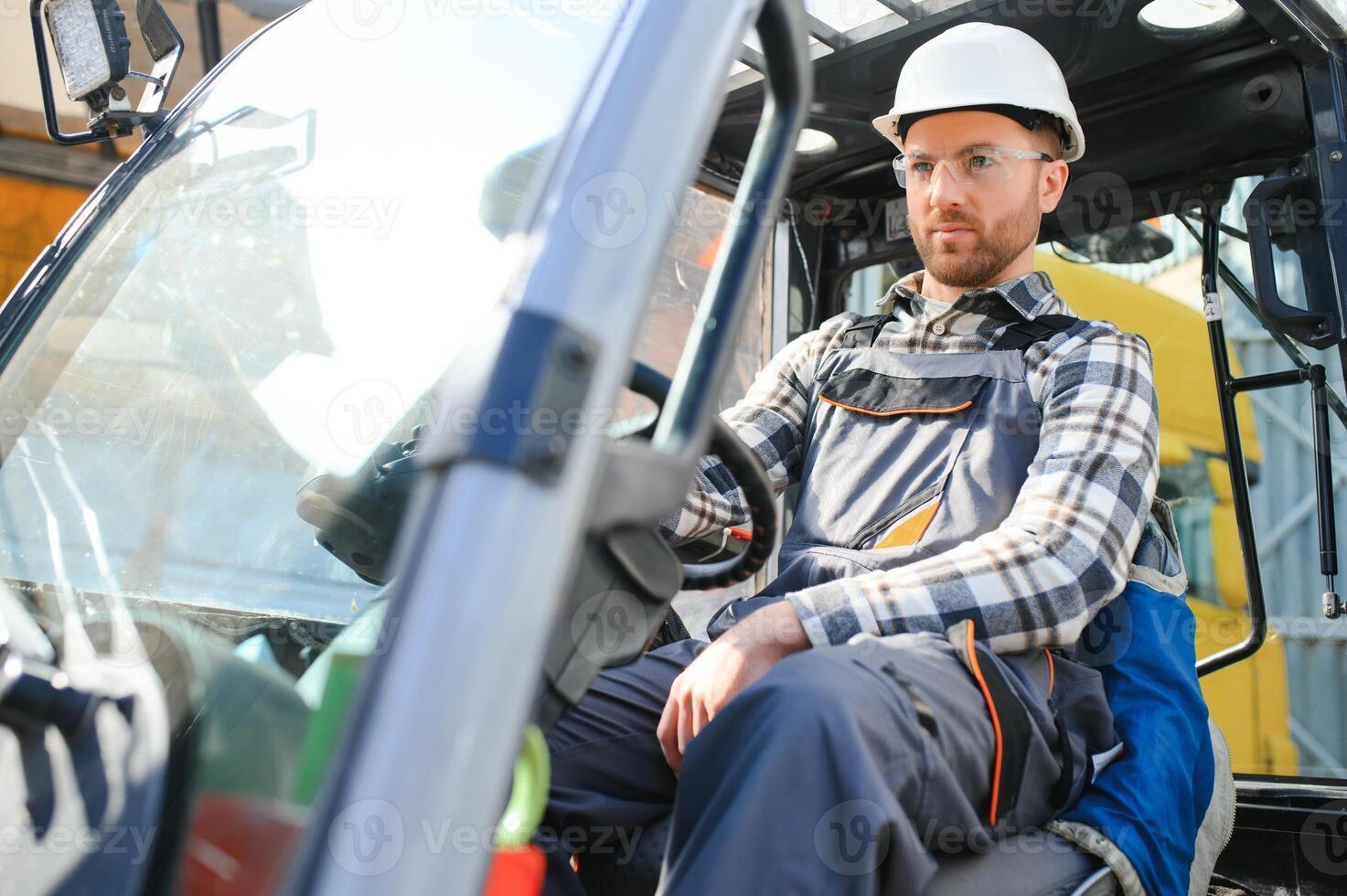 Warehouse man worker with forklift photo