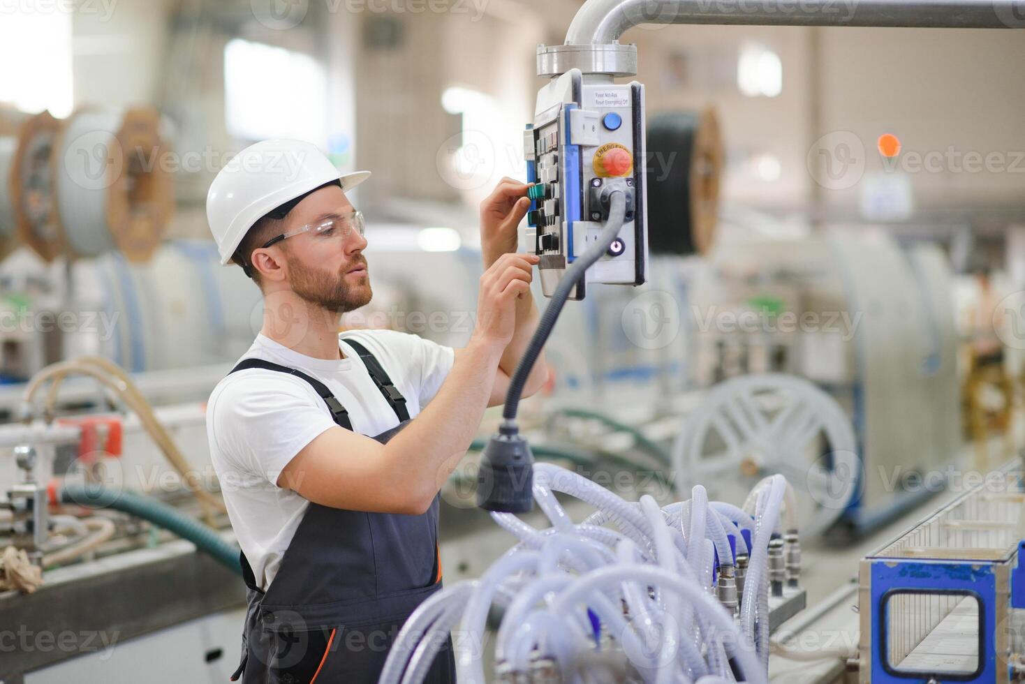 Factory worker. Man working on the production line photo