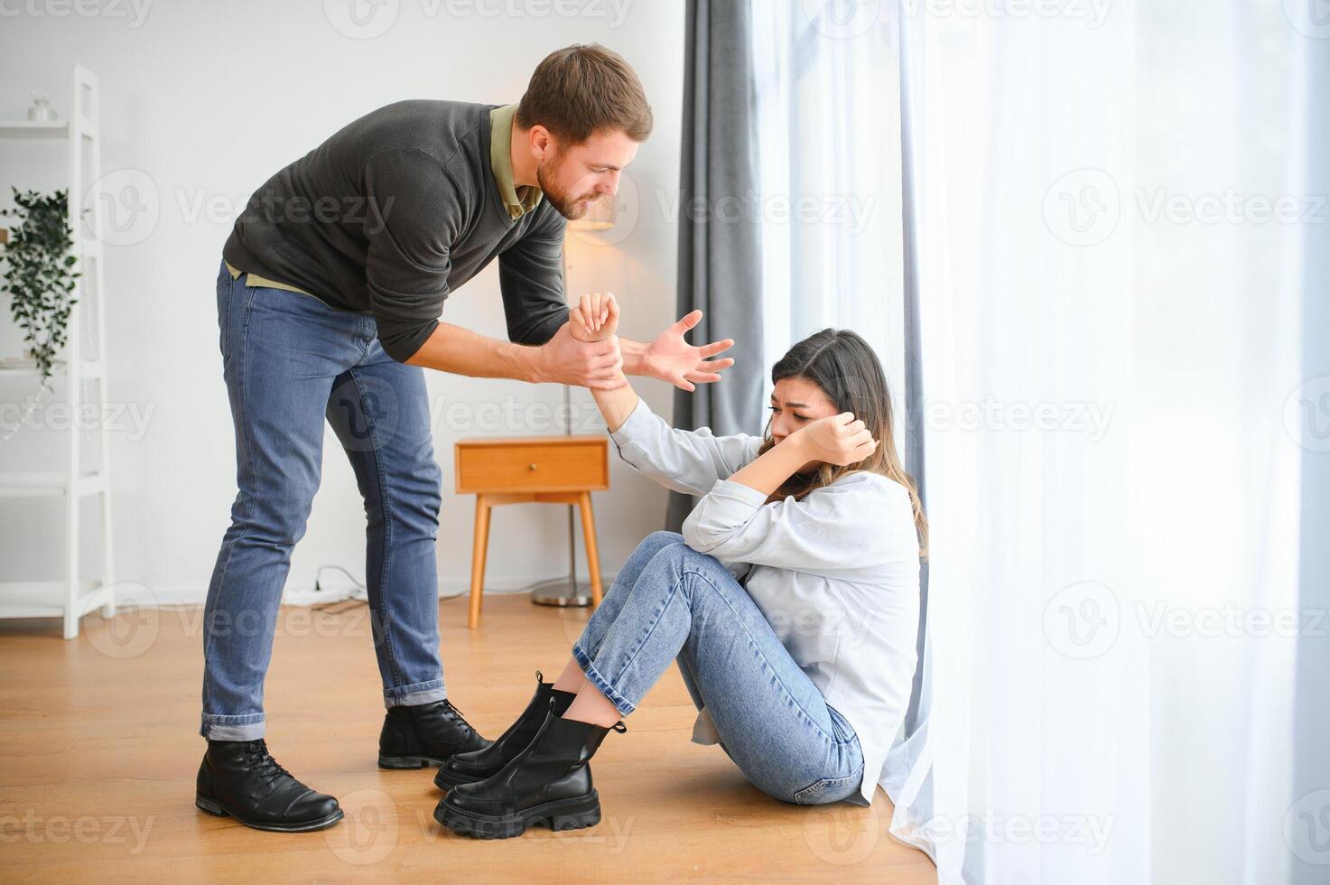 Angry husband beats his wife, domestic violence photo