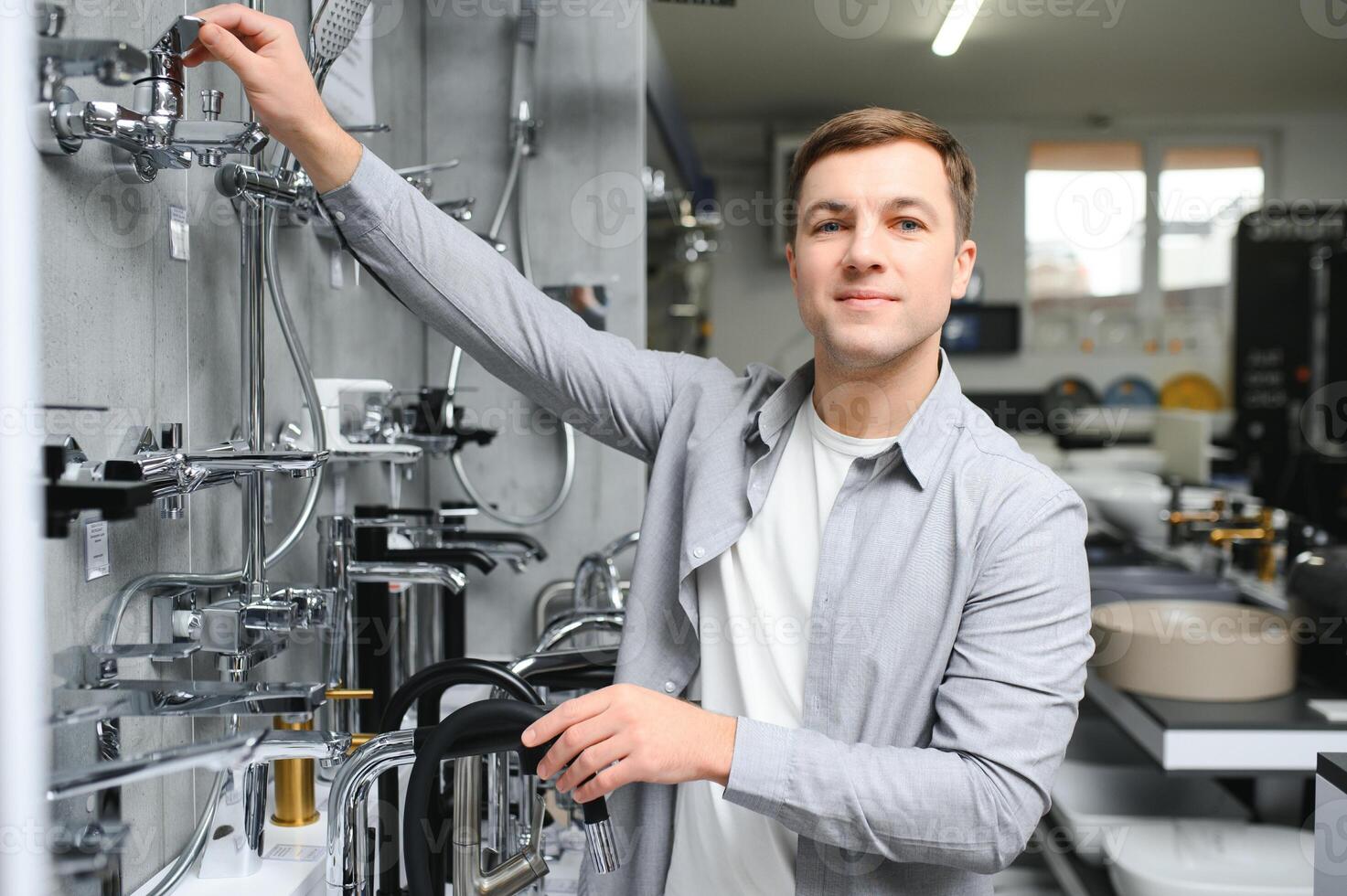 Man chooses a products in a sanitary ware store photo