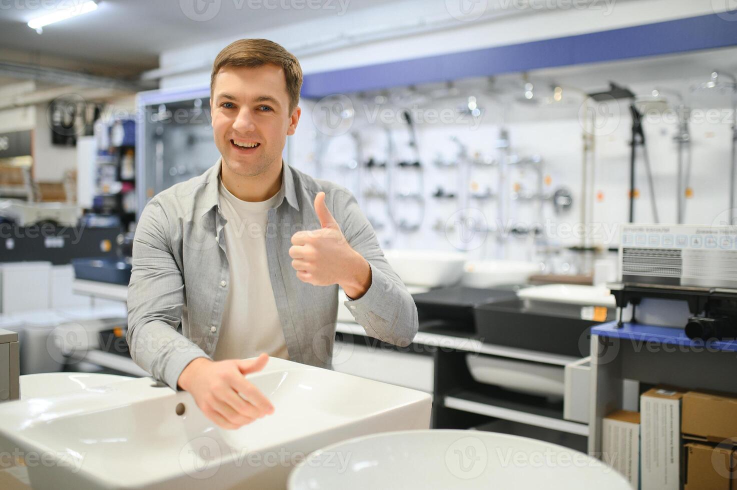 Man at the building market looking for sink into their bathroom photo