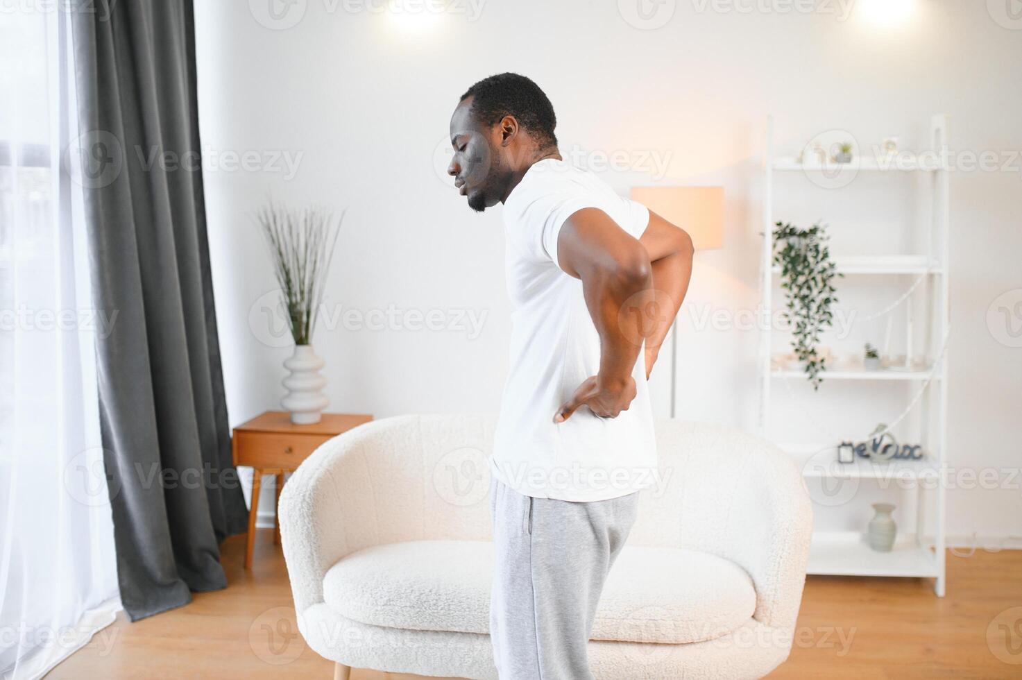 Young African Man Having Back Pain photo