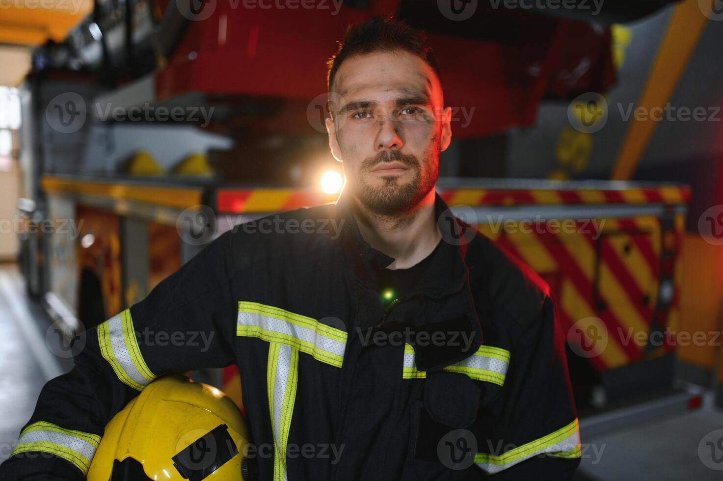 Photo of fireman with gas mask and helmet near fire engine
